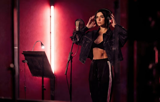 Pop singer recording vocals in a studio for modern pop type beats, clean production and vocal-focused arrangement